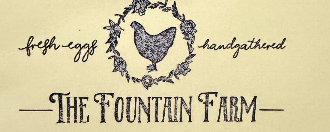 The Fountain Farm logo with chicken wreath